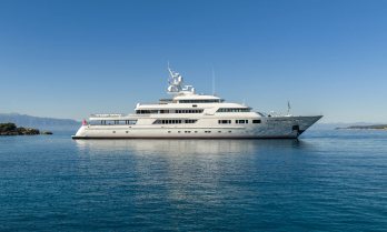 Charter yacht NOMAD at anchor in a quiet bay
